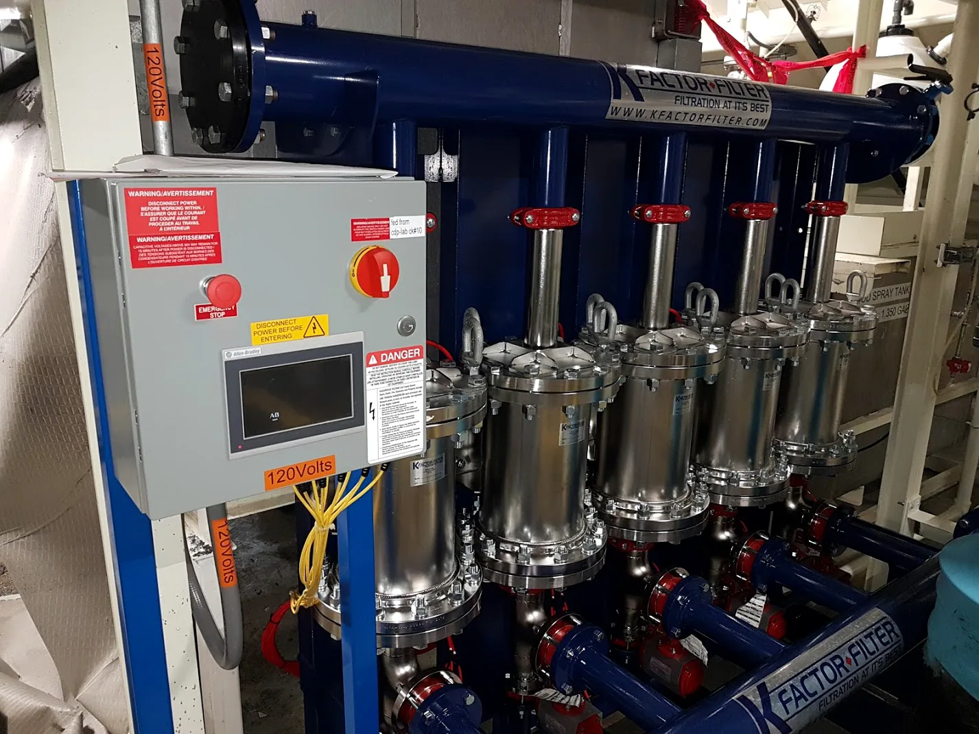 Installed K Factor automatic inline magnetic separation system with stainless magnetic housings and control panel